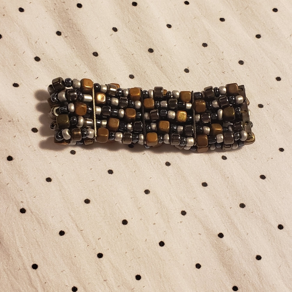 Copper, silver and black beaded stretchable bracelet.
